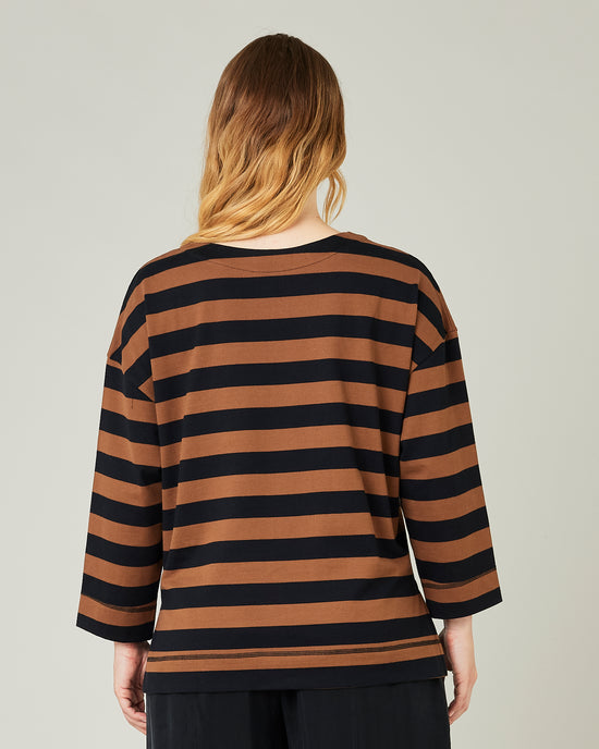 pregnant model wears rust stripe breton top