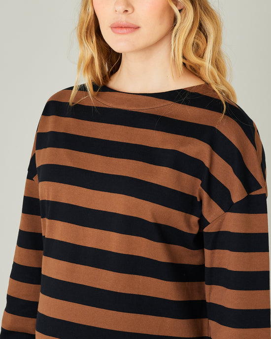 pregnant model wears rust stripe breton top