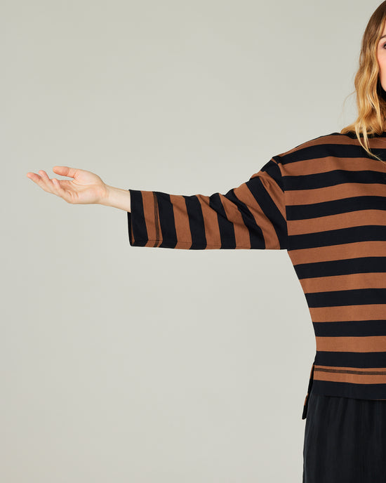 pregnant model wears rust stripe breton top