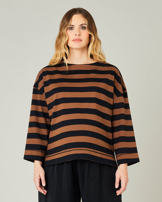 pregnant model wears rust stripe breton top