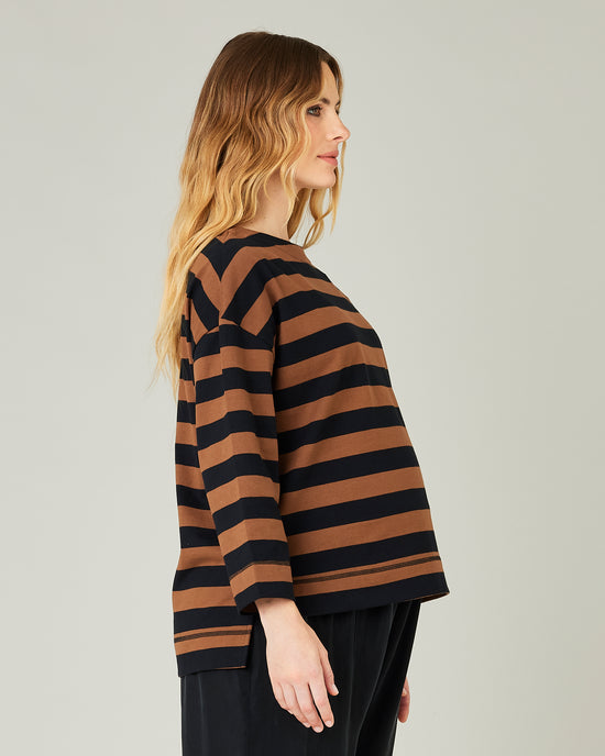 pregnant model wears rust stripe breton top