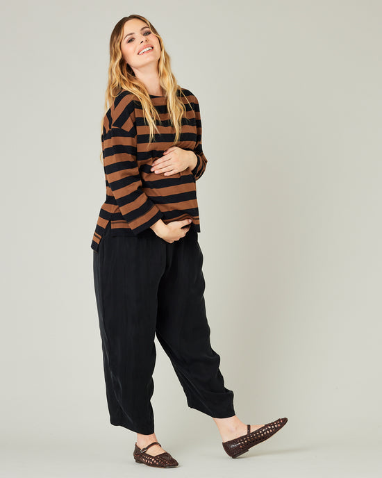 pregnant model wears rust stripe breton top