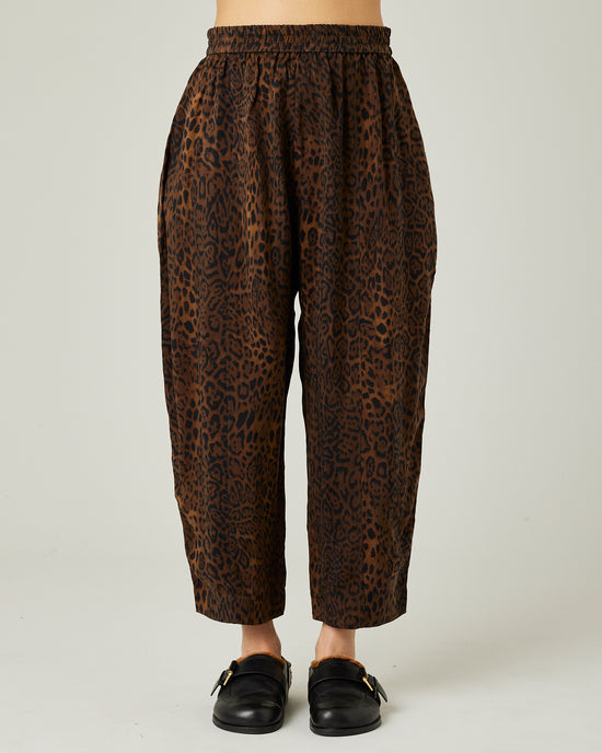 model wears mabel cupro trousers in dark leopard 