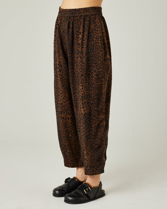 model wears mabel cupro trousers in dark leopard 