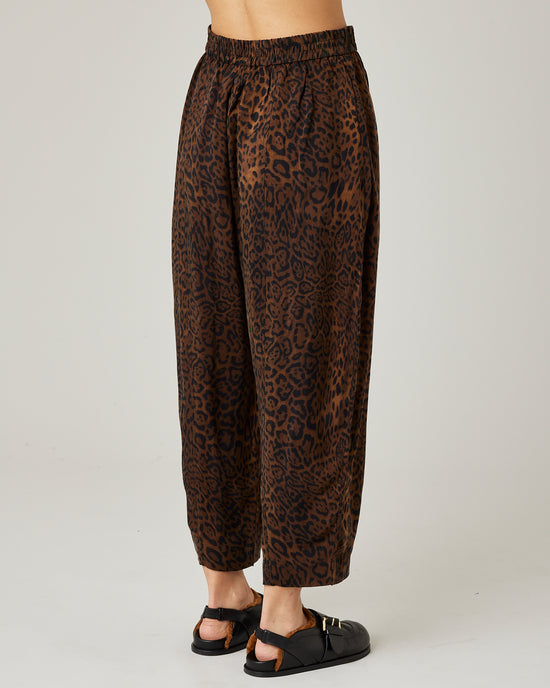 model wears mabel cupro trousers in dark leopard 