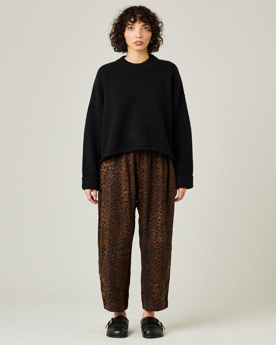 model wears mabel cupro trousers in dark leopard 