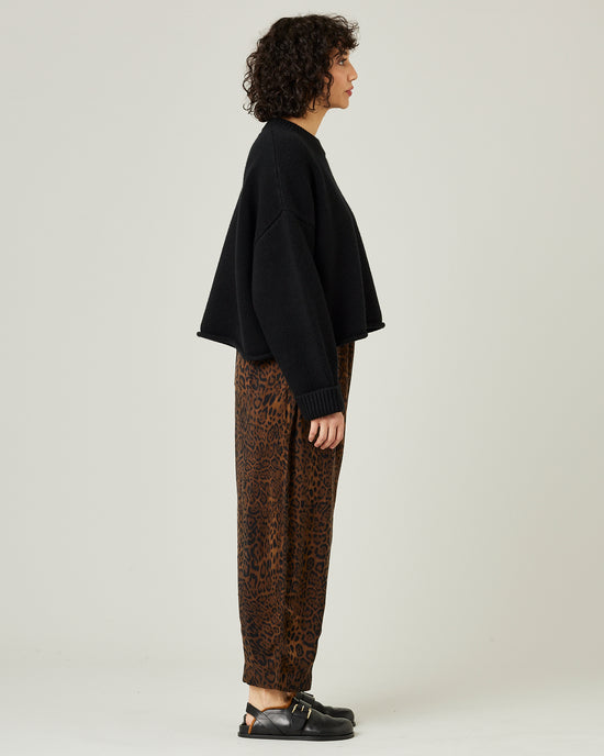 model wears mabel cupro trousers in dark leopard 