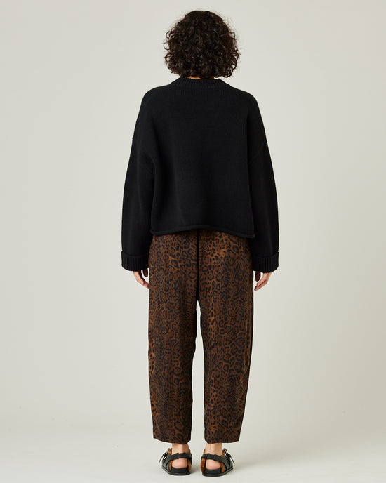 model wears mabel cupro trousers in dark leopard 