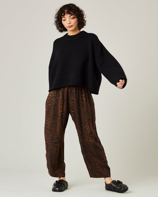 model wears mabel cupro trousers in dark leopard 