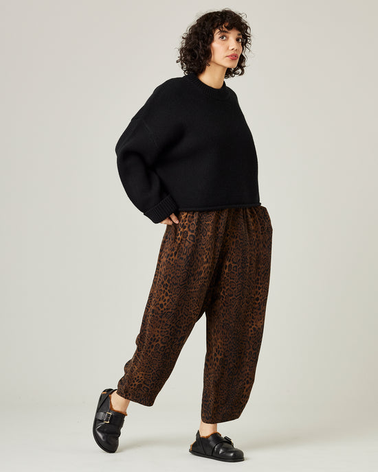 model wears mabel cupro trousers in dark leopard 