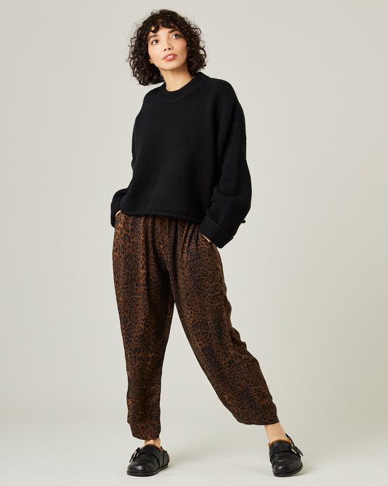 model wears mabel cupro trousers in dark leopard 