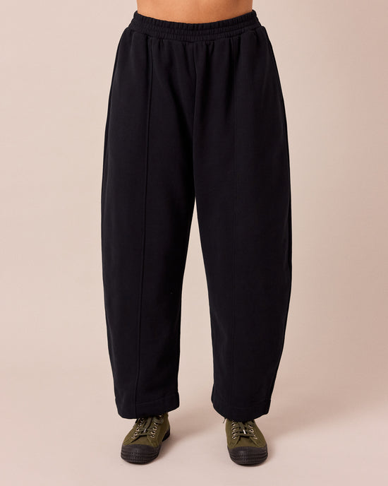 model wears mabel black fleeceback jersey trousers front