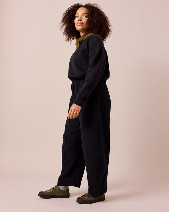 model wears mabel black fleeceback jersey trousers left
