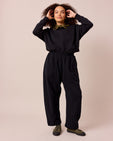 model wears mabel black fleeceback jersey trousers right
