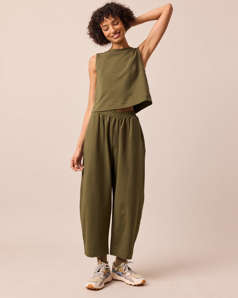model wears mabel light olive jersey trousers right