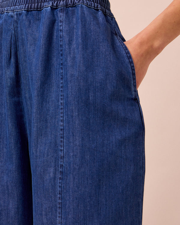 model wears mabel mid blue light denim trousers