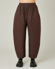 model wears chocolate linen mabel trousers