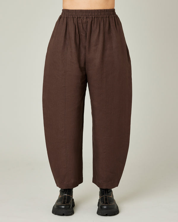 model wears chocolate linen mabel trousers