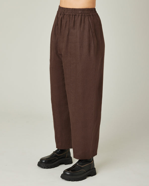 model wears chocolate linen mabel trousers
