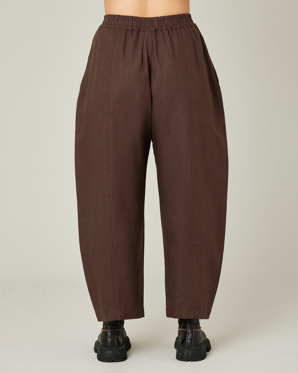 model wears chocolate linen mabel trousers