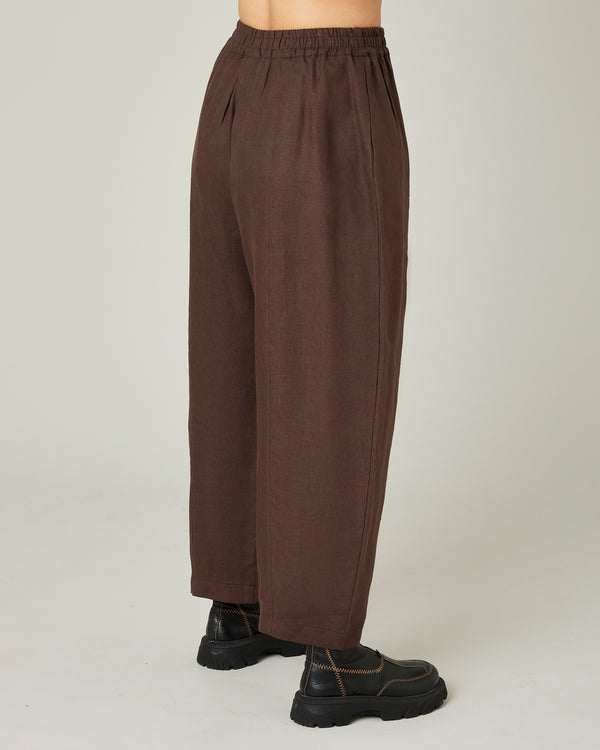 model wears chocolate linen mabel trousers