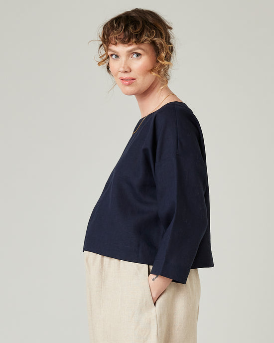 pregnant model wears navy linen lily top 