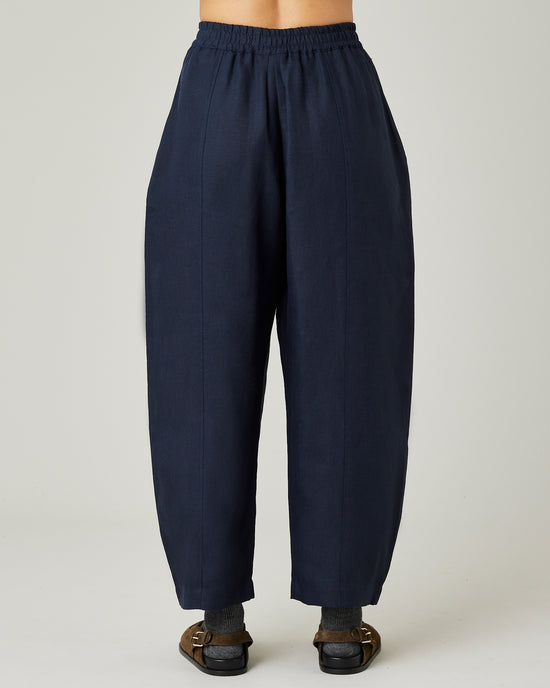 model wears navy linen mabel trousers back