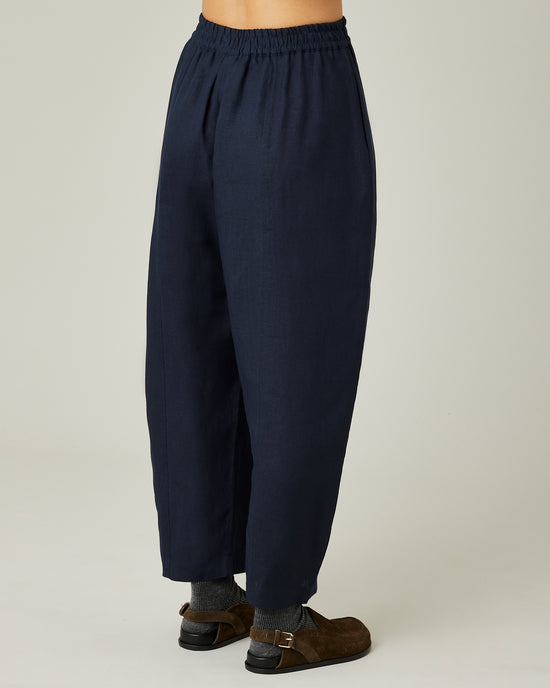 model wears navy linen mabel trousers right