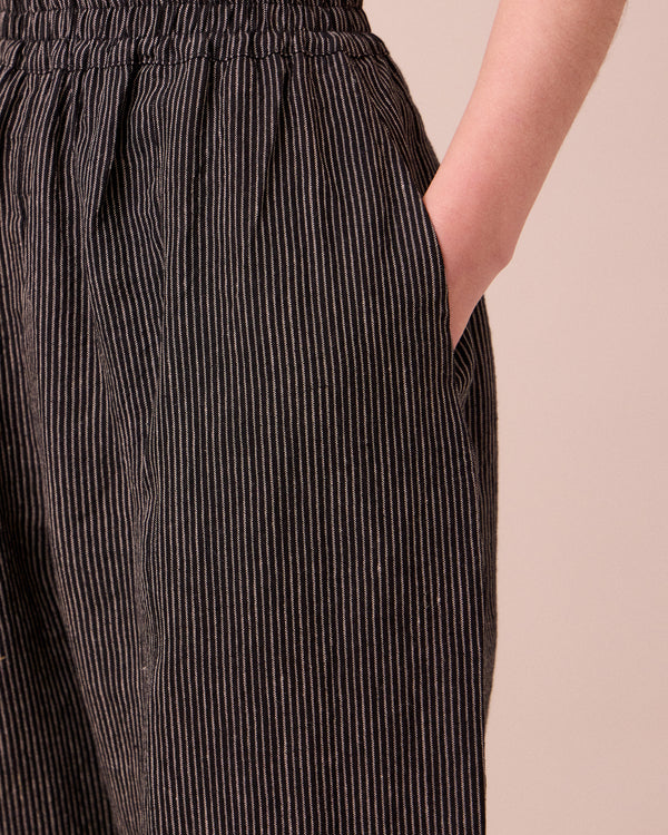 model wears mabel pencil stripe linen trousers 
