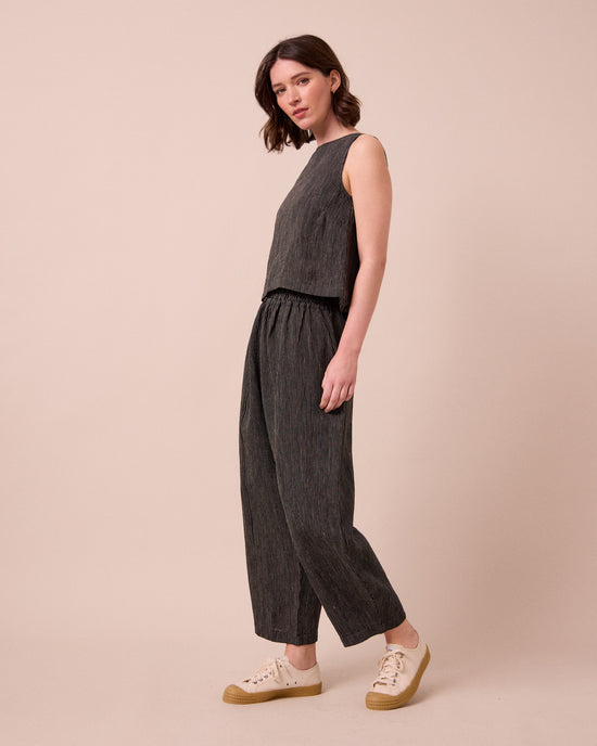 model wears mabel pencil stripe linen trousers right