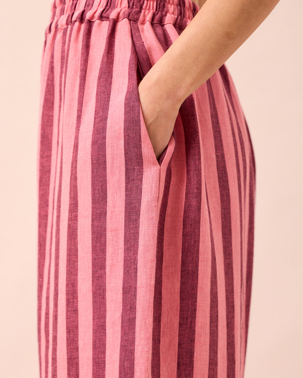 model wears mabel fiesta pink linen trousers