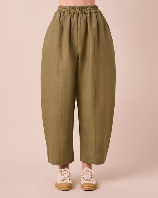 model wears mabel khaki linen trousers front