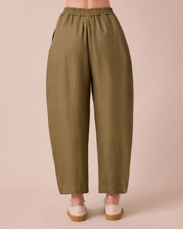 model wears mabel khaki linen trousers back