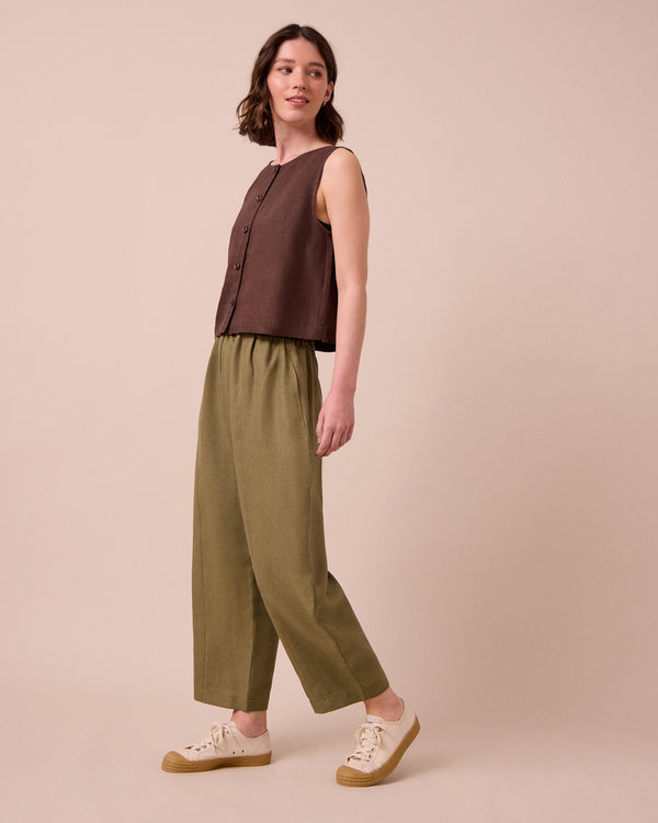 model wears mabel khaki linen trousers right