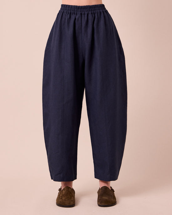 model wears mabel navy linen trousers front