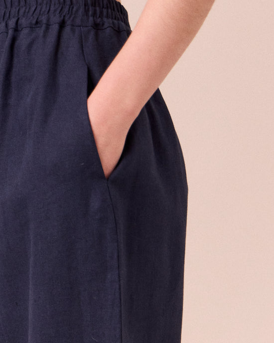 model wears mabel navy linen trousers 