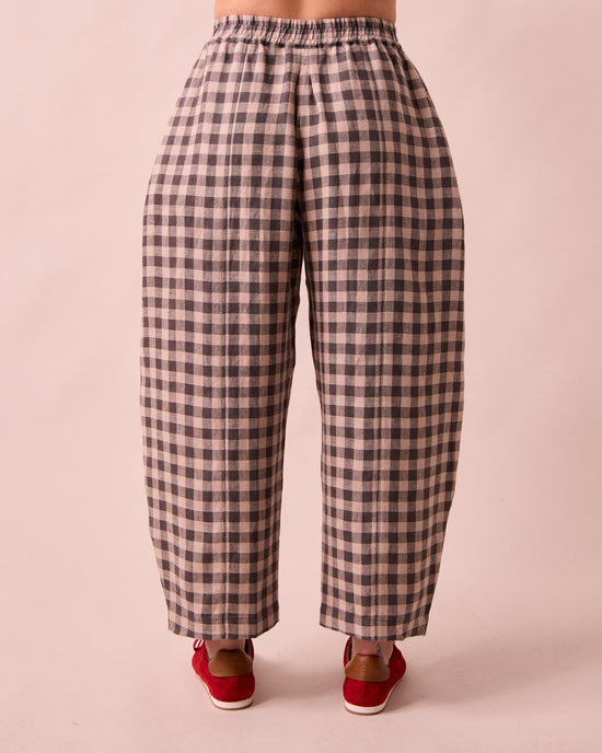model wears mabel stone gingham linen trousers back