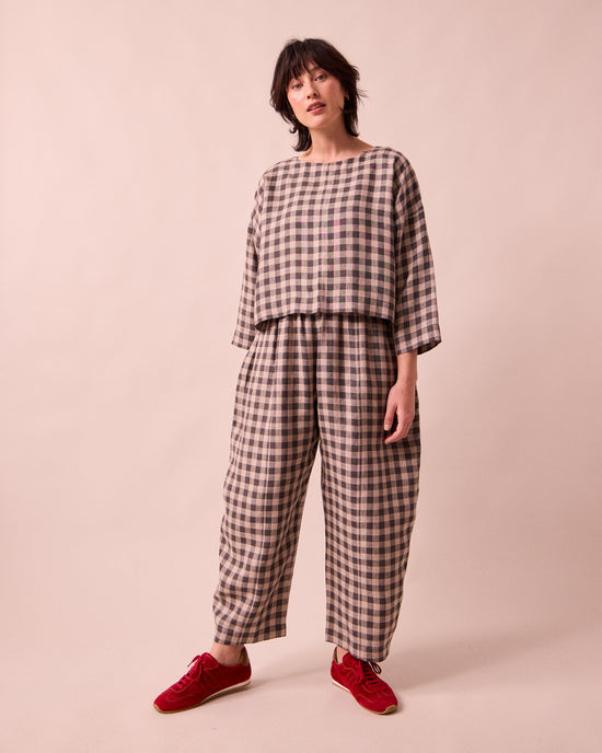 model wears mabel stone gingham linen trousers right