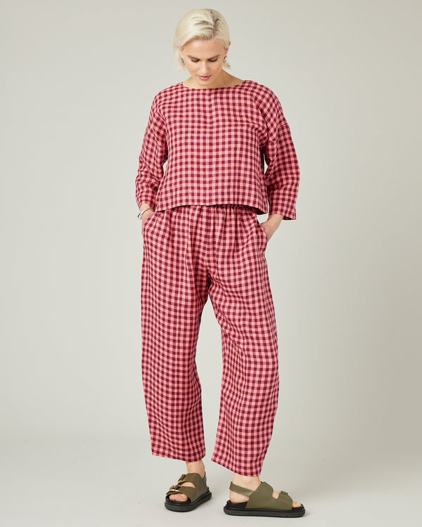 model wears blush gingham mabel linen trousers