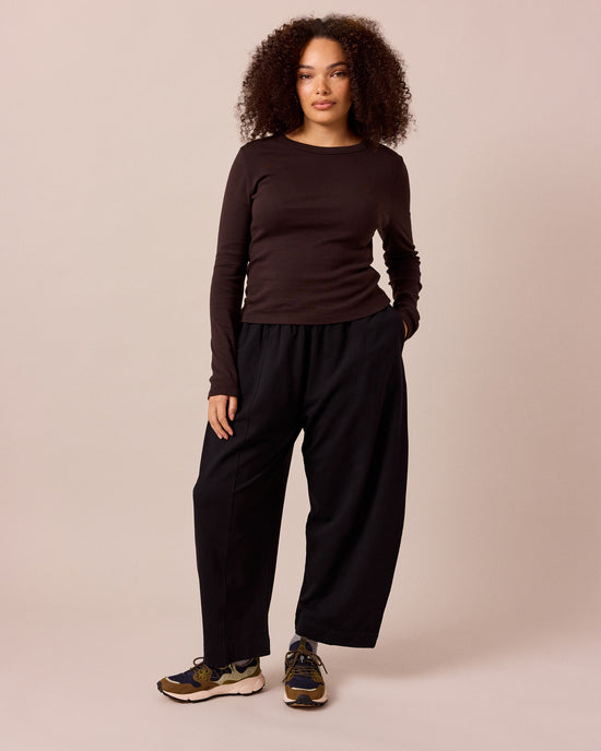 model wears mabel black loopback jersey trousers right