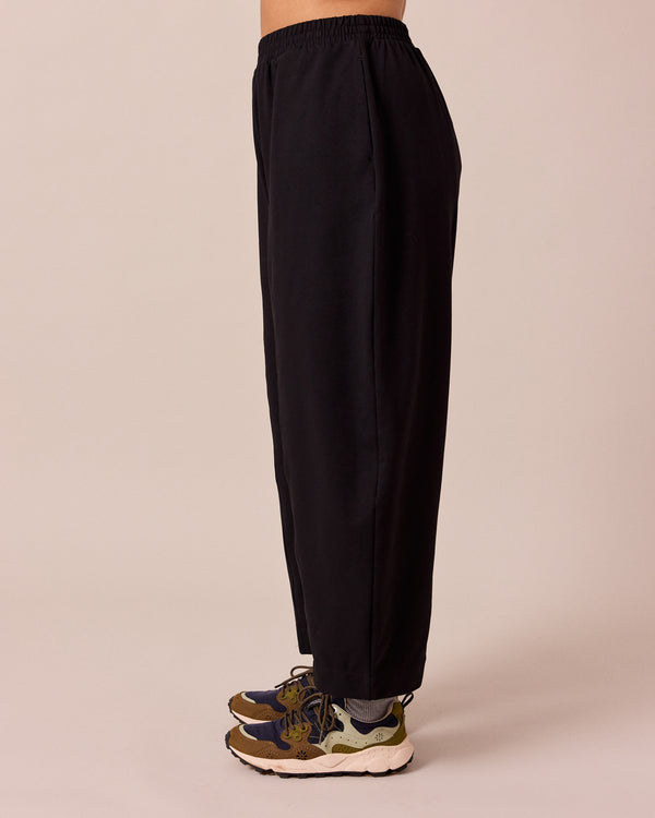 model wears mabel black loopback jersey trousers left