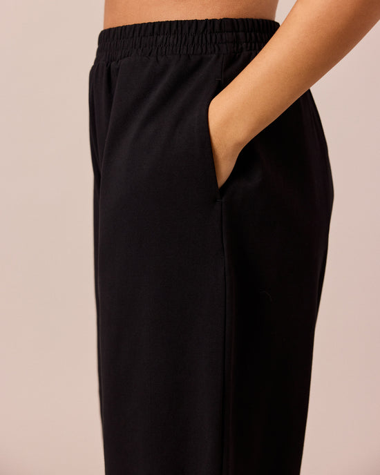 model wears mabel black loopback jersey trousers