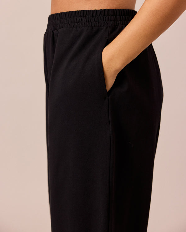 model wears mabel black loopback jersey trousers