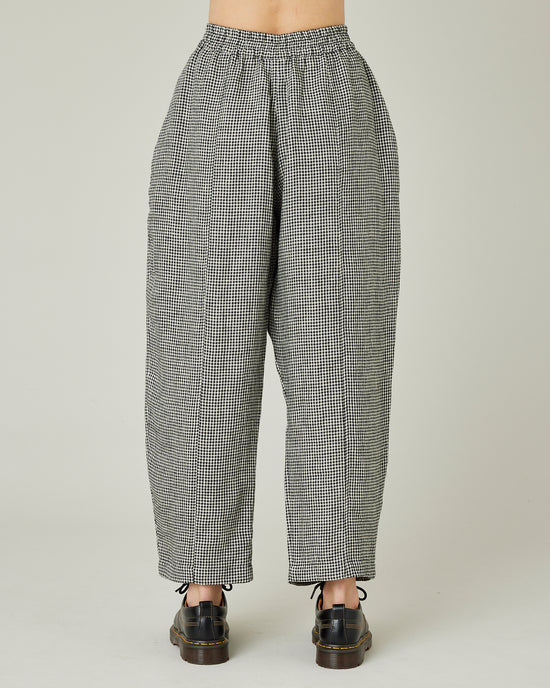 model wears black and stone micro check linen mabel trousers back