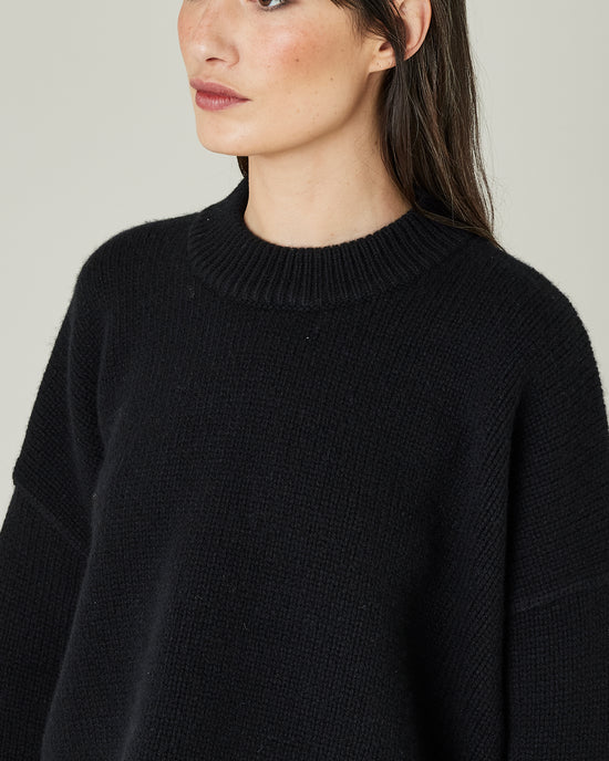 model wears black coco knitted jumper