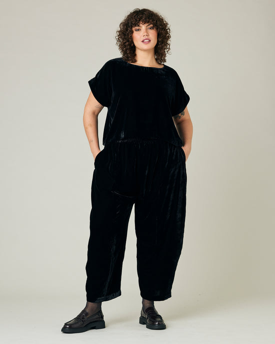 model wears black velvet polly top and mabel trousers