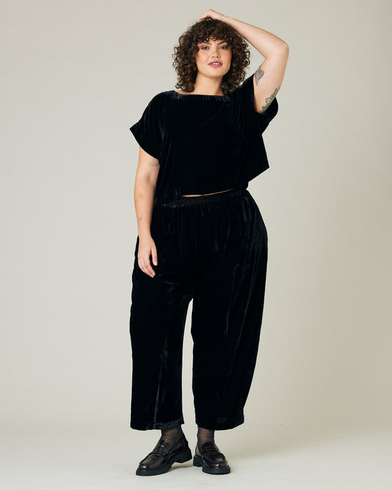 model wears black velvet polly top and mabel trousers