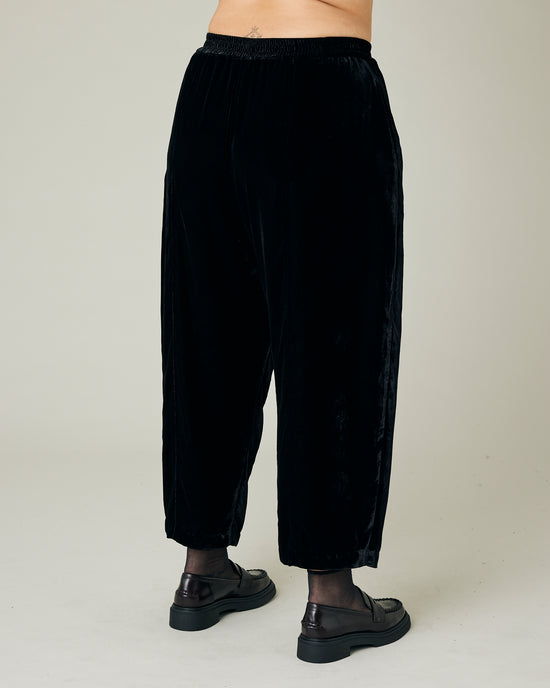 model wears black velvet mabel trousers