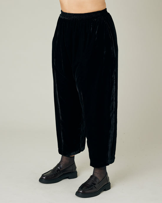 model wears black velvet polly top and mabel trousers