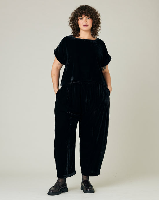 model wears black velvet polly top and mabel trousers